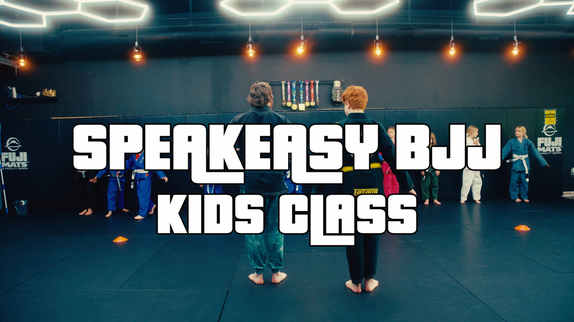 Children practicing Jiu Jitsu together at Speak Easy