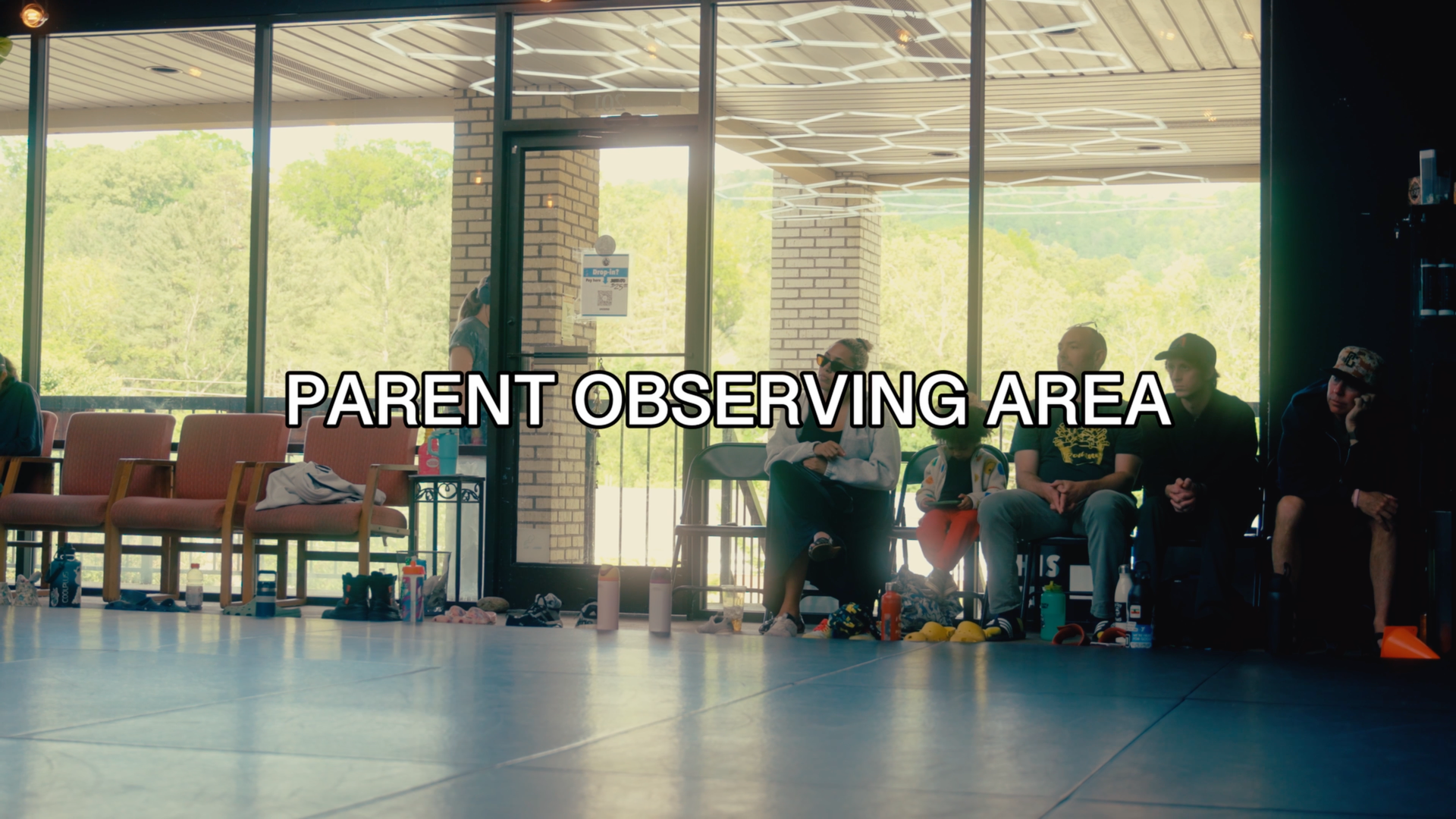 Parents watching training inside Speak Easy Jiu Jitsu